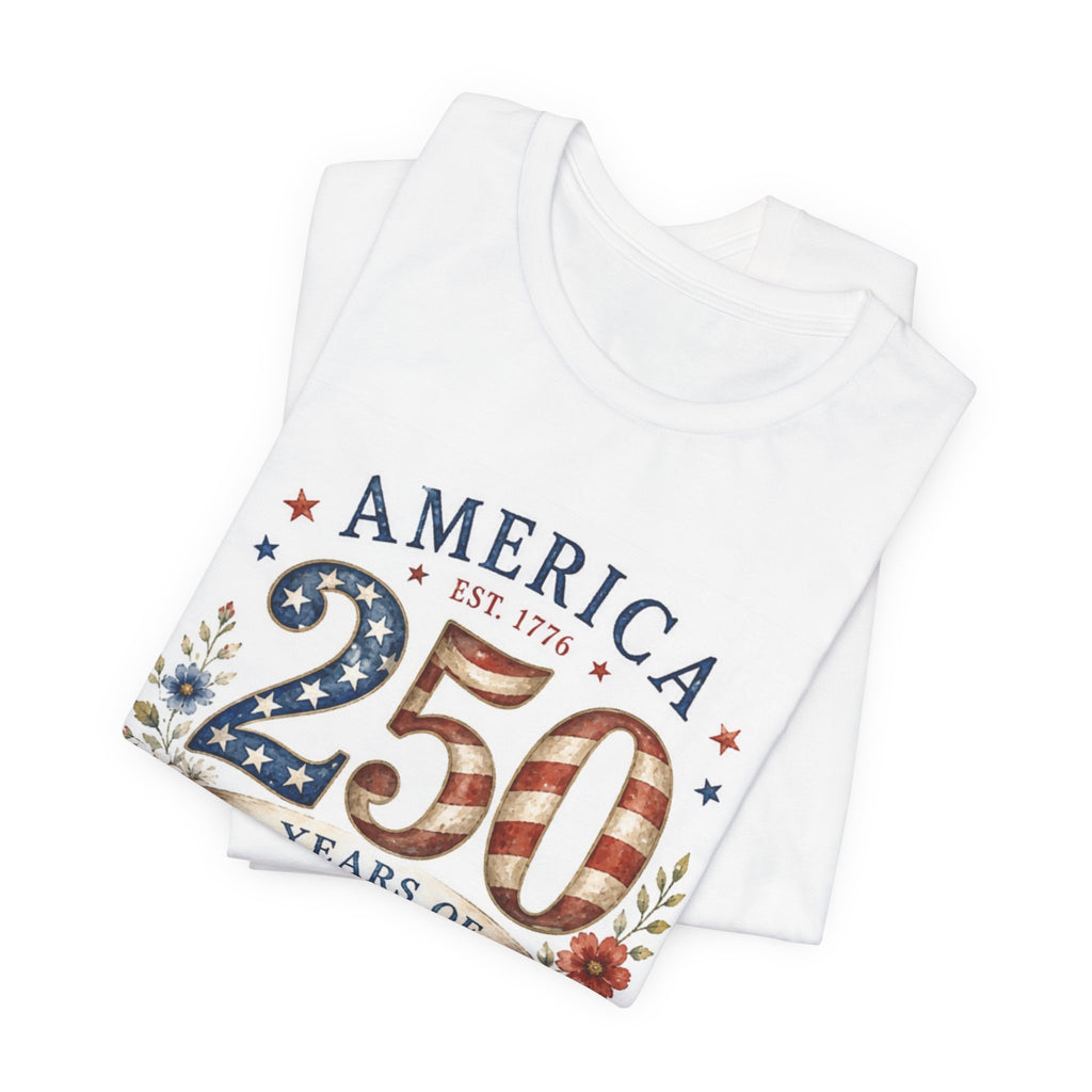 White t-shirt with "America 250 EST. 1776" and patriotic flag design.