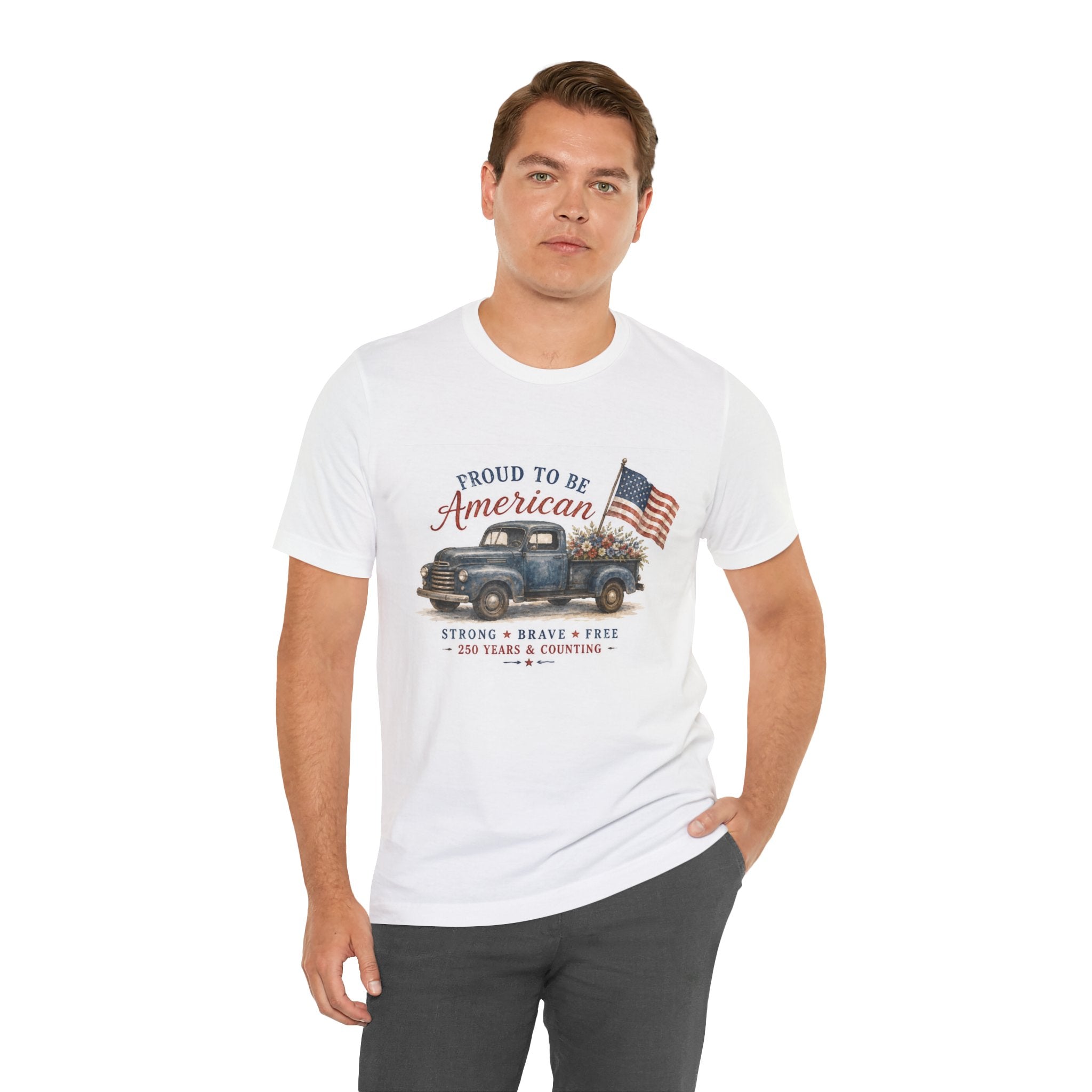 White t-shirt with graphic of a vintage blue truck, American flag, and text.