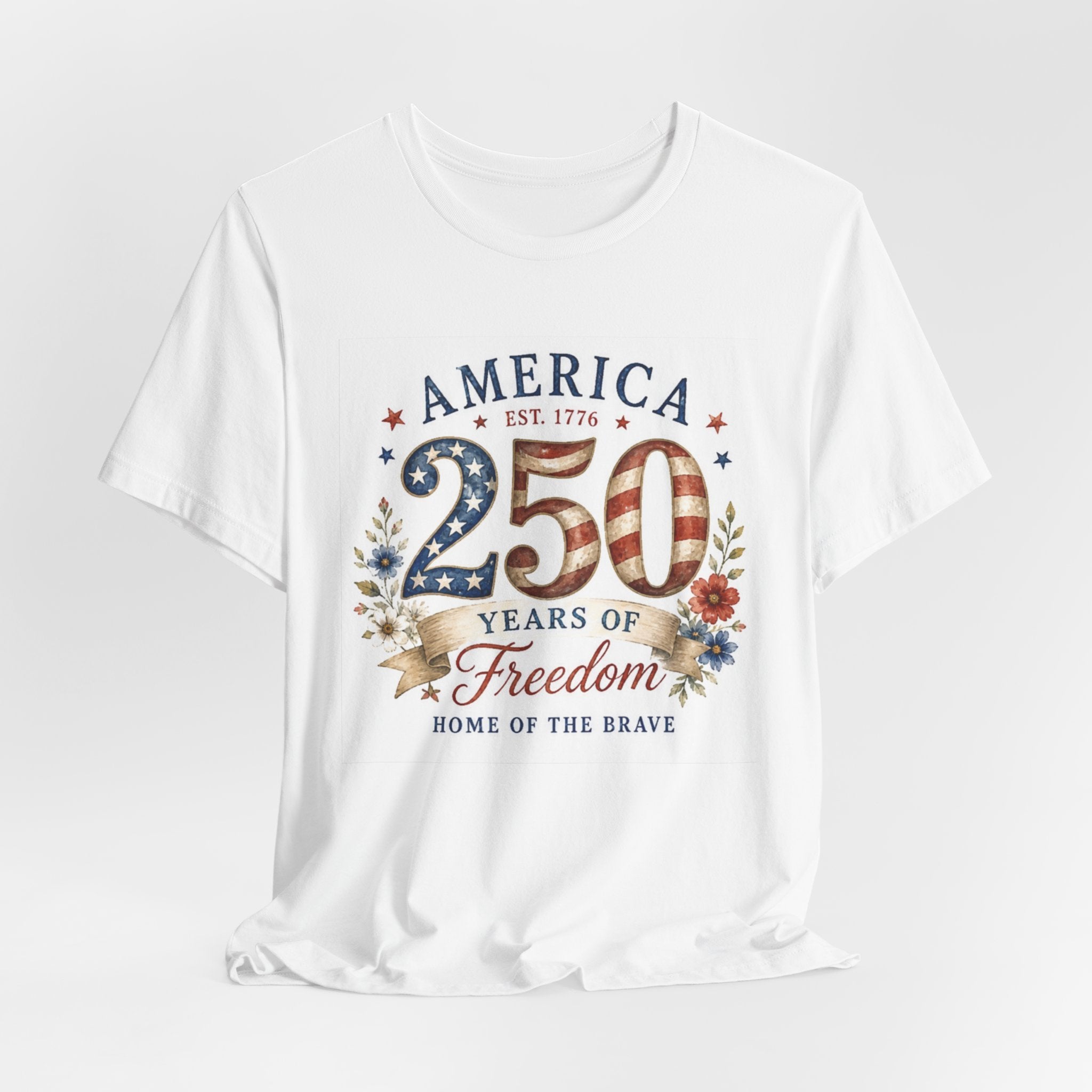 White t-shirt with "America 250 Est. 1776 Freedom Home of the Brave" graphic.